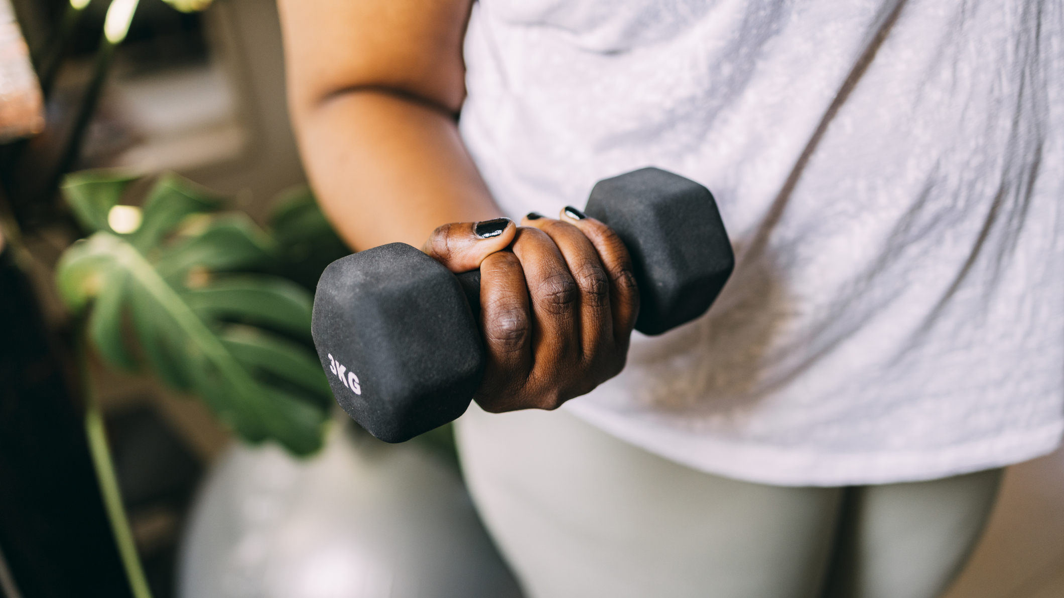 Close up of hand holding dumbbell