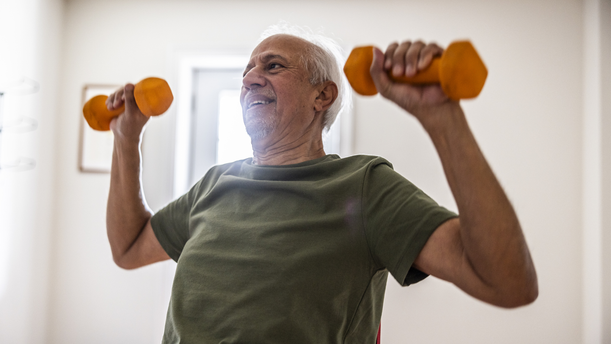 Man exercising with dumbbells
