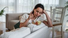 woman stares at unappealing salad 